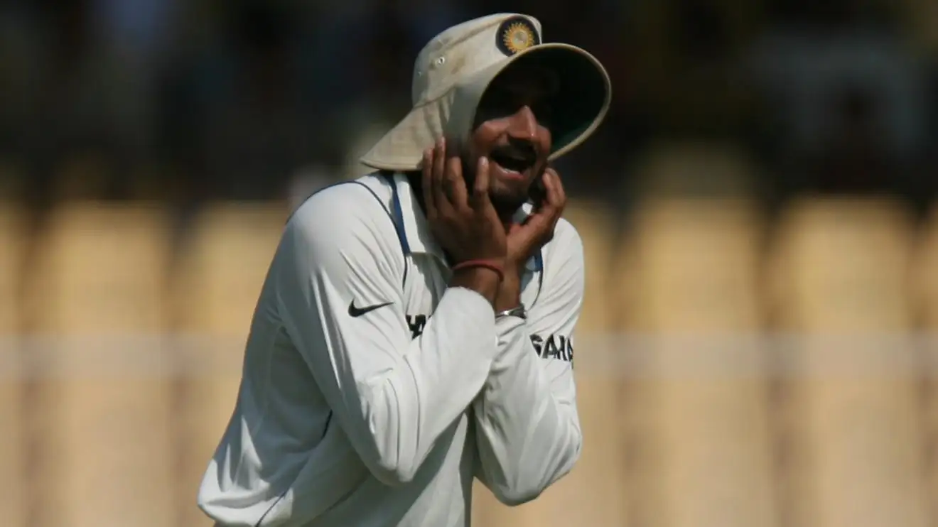 Harbhajan Singh holds his hat