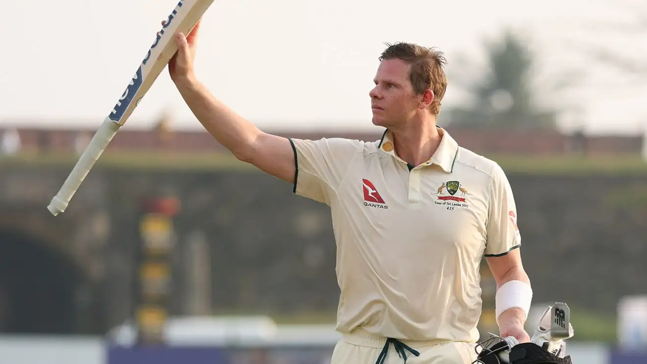 Steven Smith raises his bat