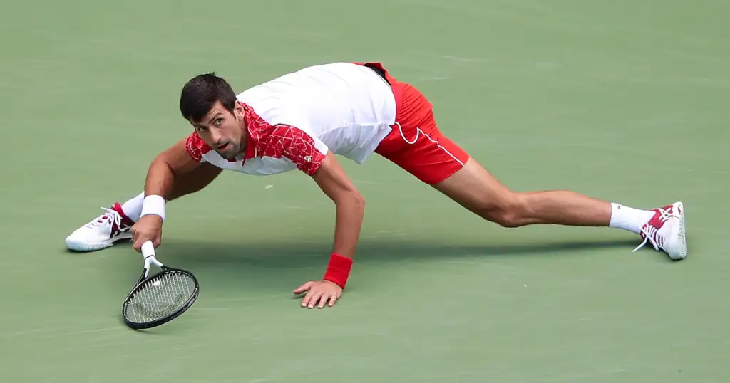 Novak Djokovic sliding