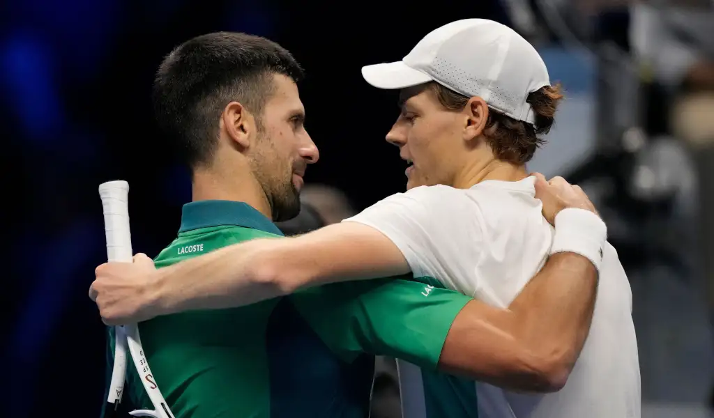 Novak Djokovic and Jannik Sinner post-match hug