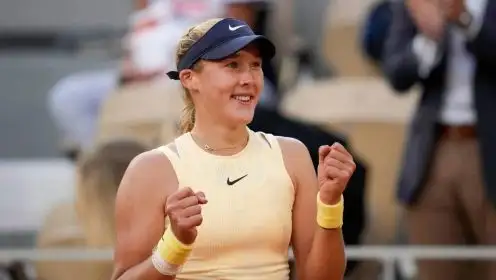 Russia's Mirra Andreeva celebrates winning her quarterfinal match of the French Open tennis tournament against Aryna Sabalenka of Belarus at the Roland Garros stadium in Paris