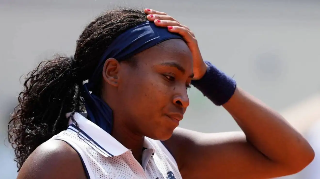Coco Gauff of the U.S. reacts after missing a shot against Poland's Iga Swiatek during their semifinal match of the French Open tennis tournament at the Roland Garros stadium in Paris