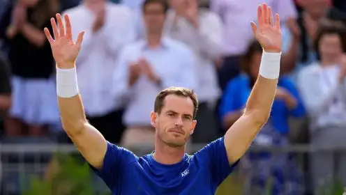 Andy Murray of Britain holds up his hands to applause from the crowd as he retires due to injury from his match against Jordan Thompson of Australia during their men's singles match on day five of The Queen's Club tennis tournament, in London