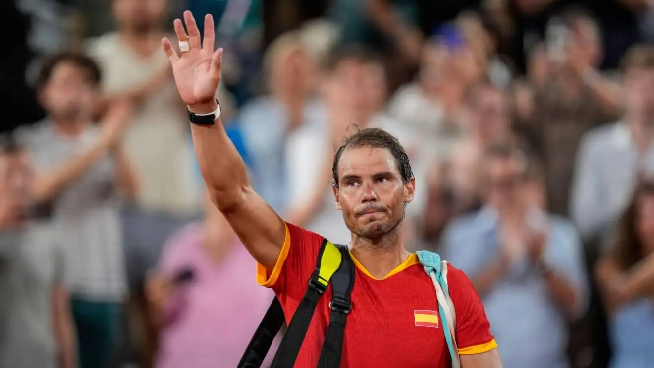 Rafael Nadal waves to the crowd after he and Carlos Alcaraz lost their doubles match at the 2024 Paris Olympics