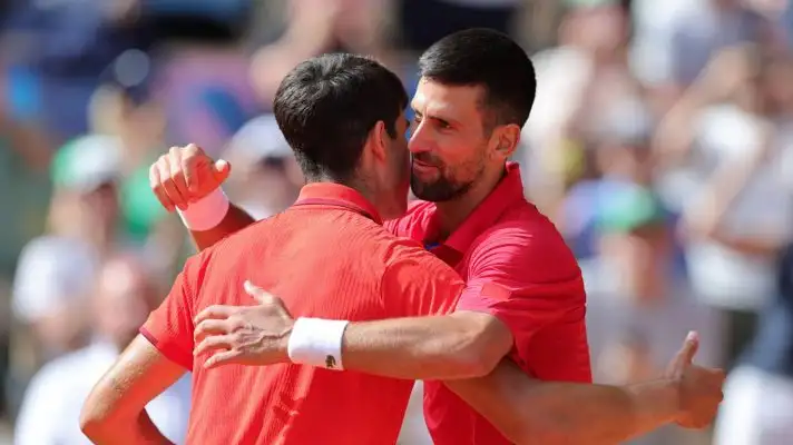 Carlos Alcaraz and Novak Djokovic at the net after the 2024 Paris Olympics gold medal match