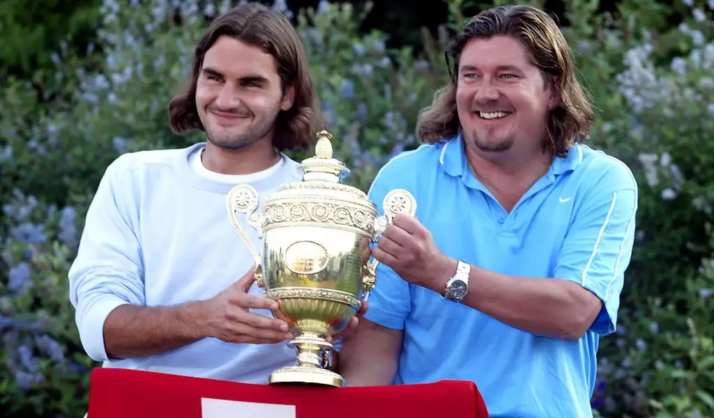 Peter Lundgren pictured with Roger Federer after the Swiss's 2003 Wimbledon win