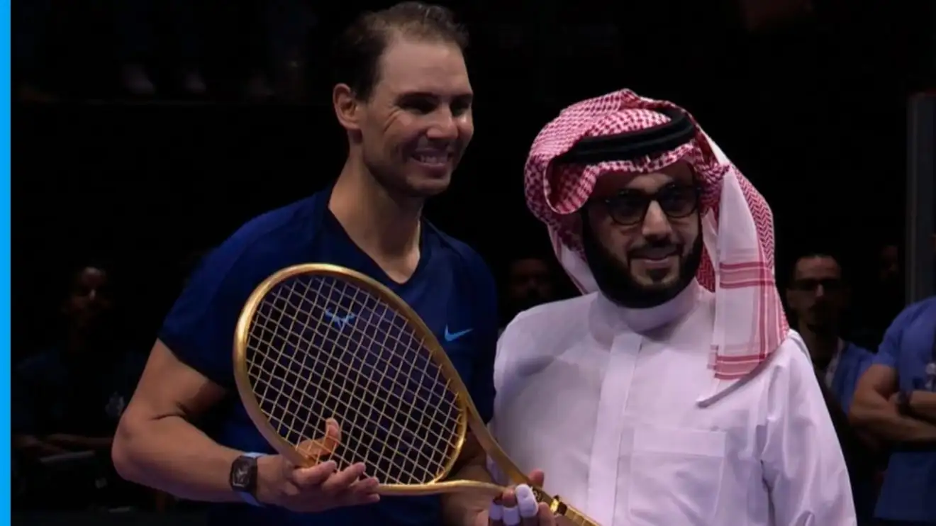 Rafael Nadal with a golden tennis racket