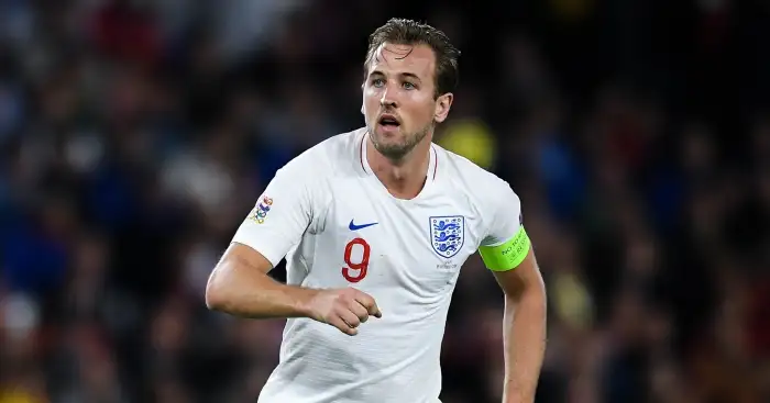 Harry Kane poses in full American Football attire