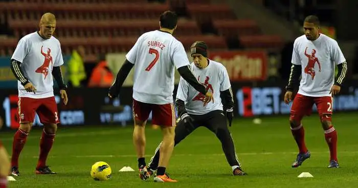 Liverpool FC Wears T-Shirts Supporting Luis Suarez During Pregame Warm-Ups  