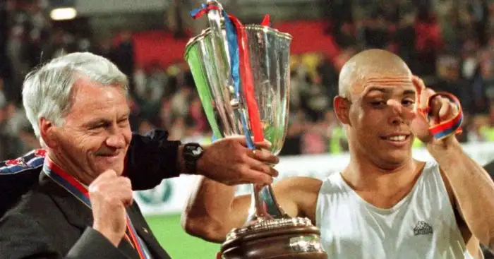 Ronaldo Nazario looks at his 2002 FIFA World Cup winners trophy