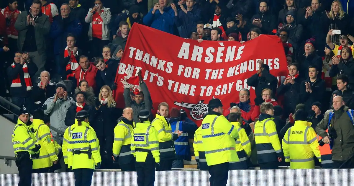 Arsenal fans hold up a banner