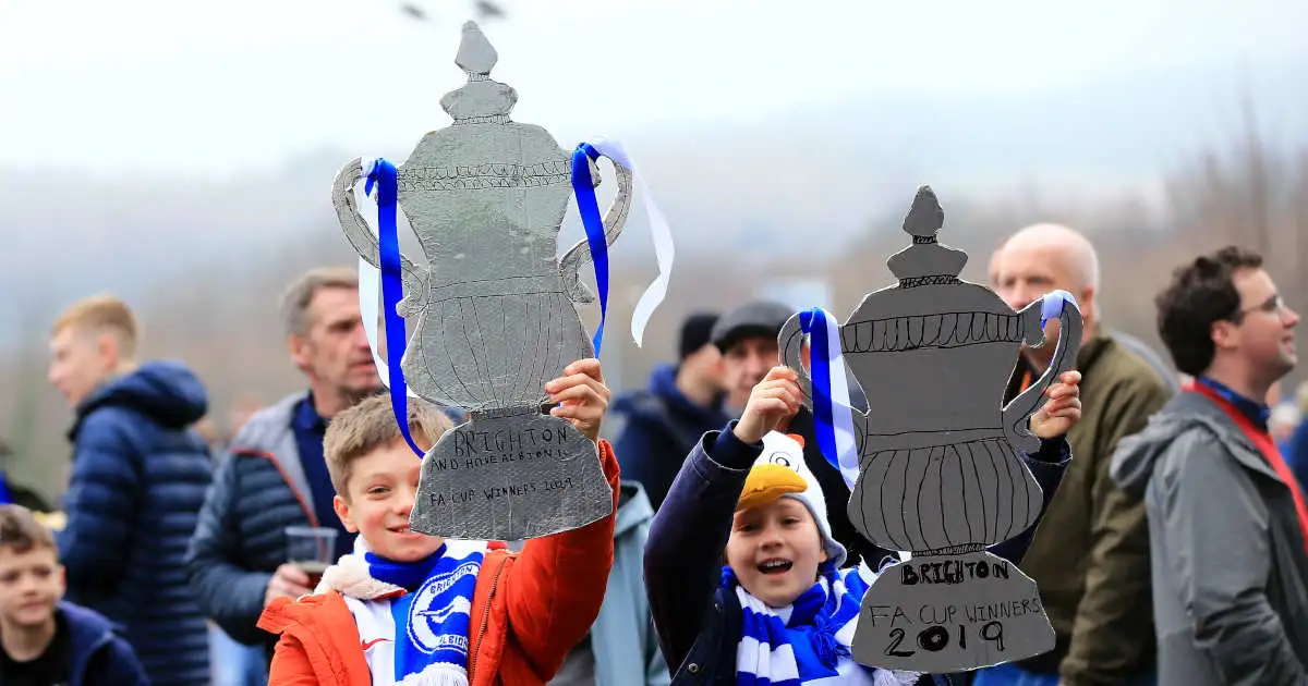 Brighton fans with a tin foil FA Cup