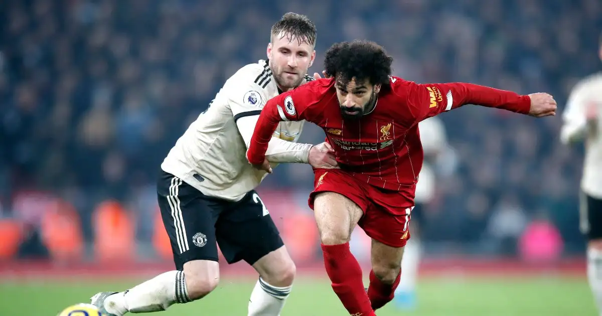 Mo Salah holds of Manchester United defender Luke Shaw