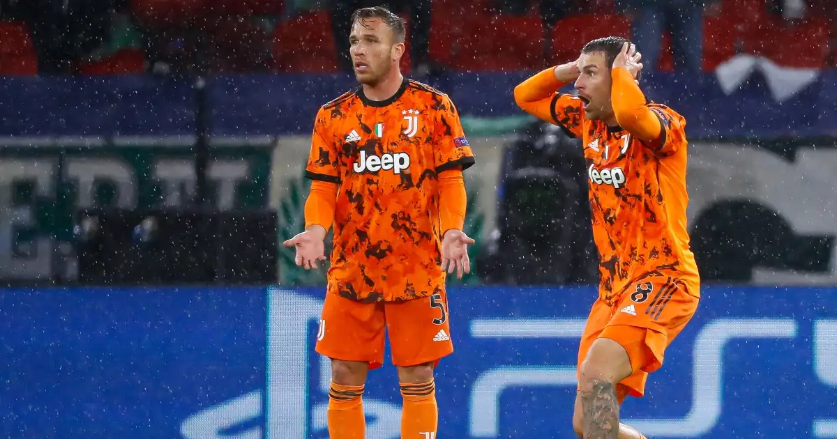 Juventus midfielders Arthur and Aaron Ramsey looking shocked