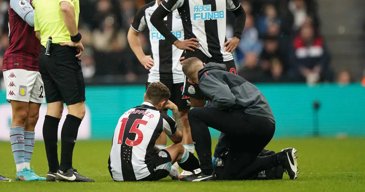 Newcastle United's Kieran Trippier receives attention