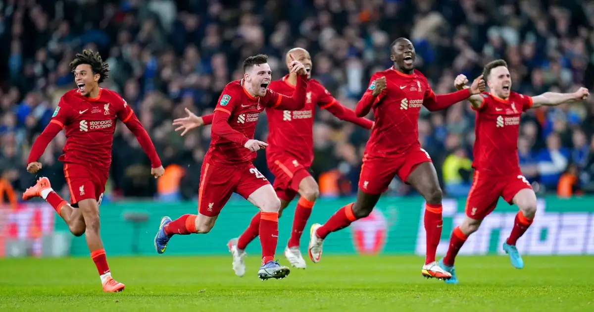 Liverpool players celebrate winning a penalty shootout