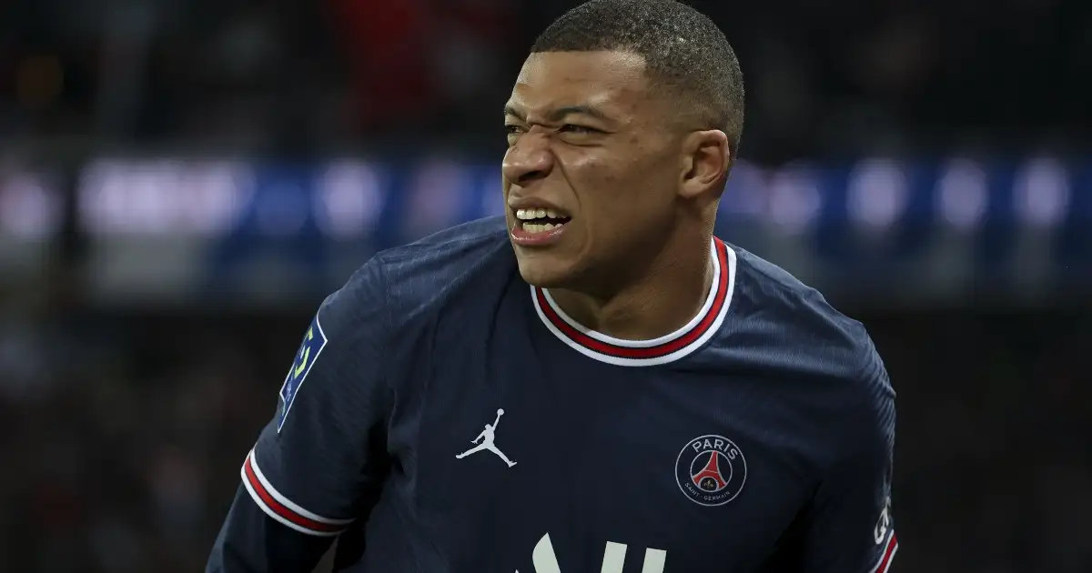 Kylian Mbappe looks in pain following a tackle