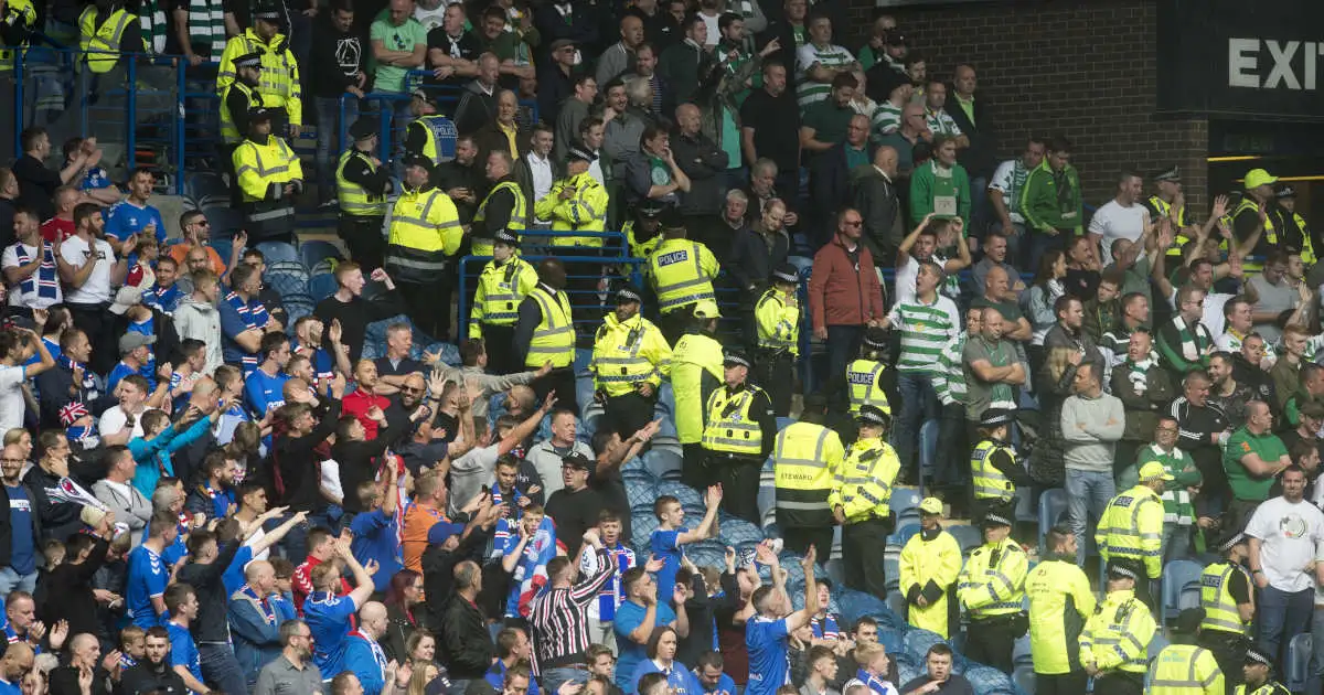Celtic and Rangers supporters, separated by the police