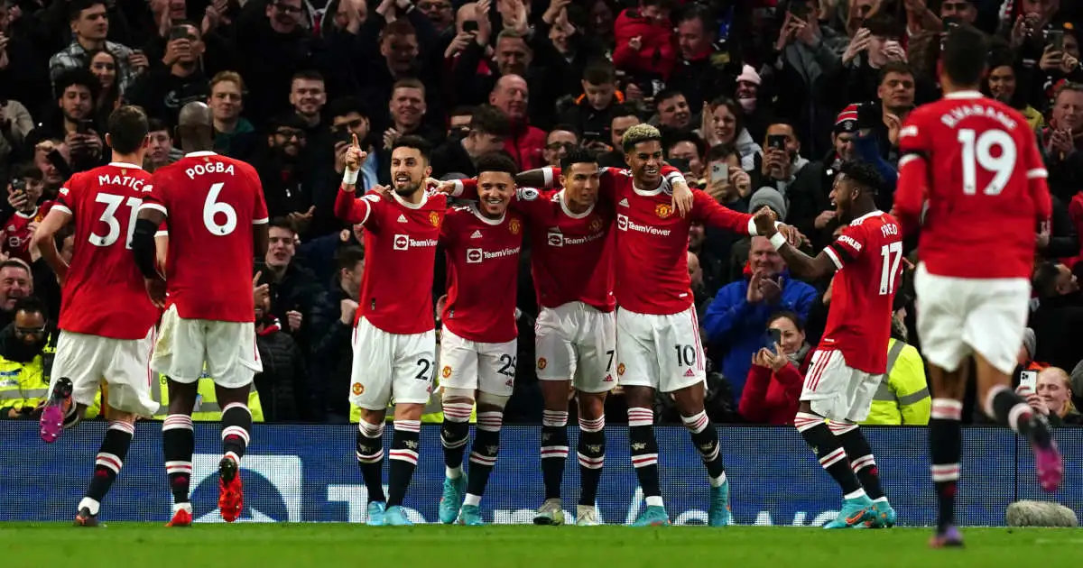 Manchester United players celebrate scoring against Spurs