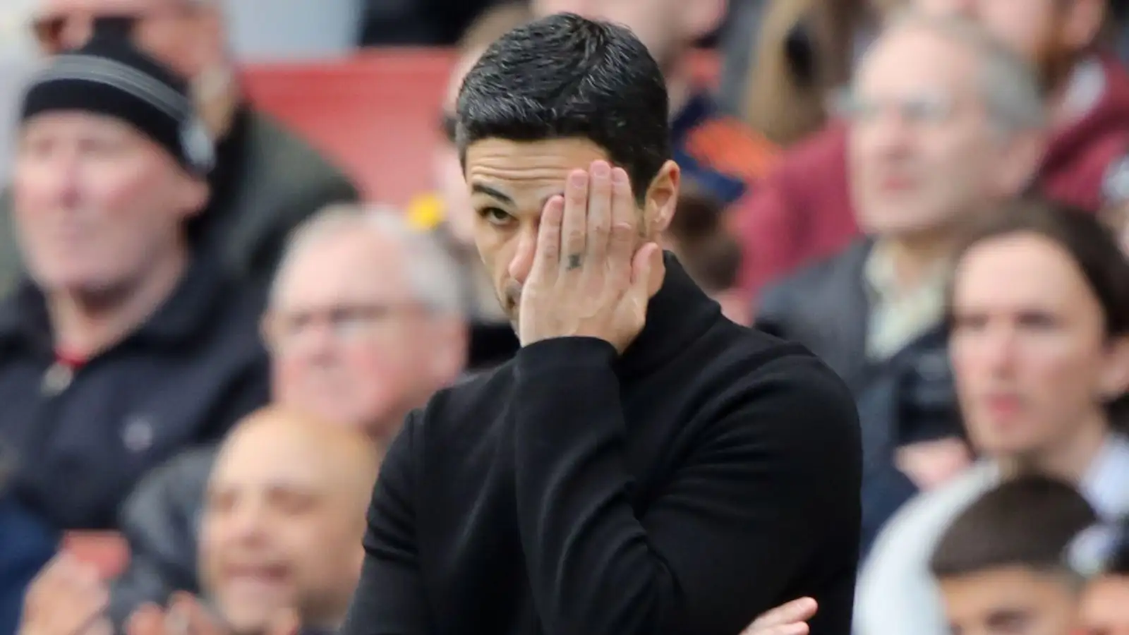 Arsenal boss Mikel Arteta puts his hand on his face
