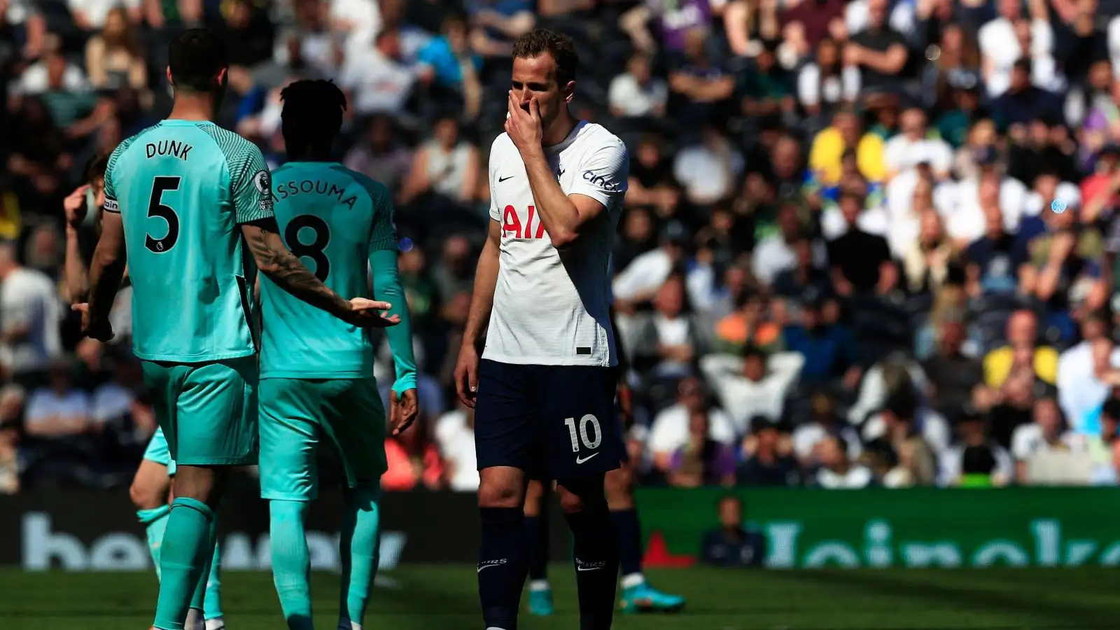 Tottenham striker Harry Kane wipes his face with his hand