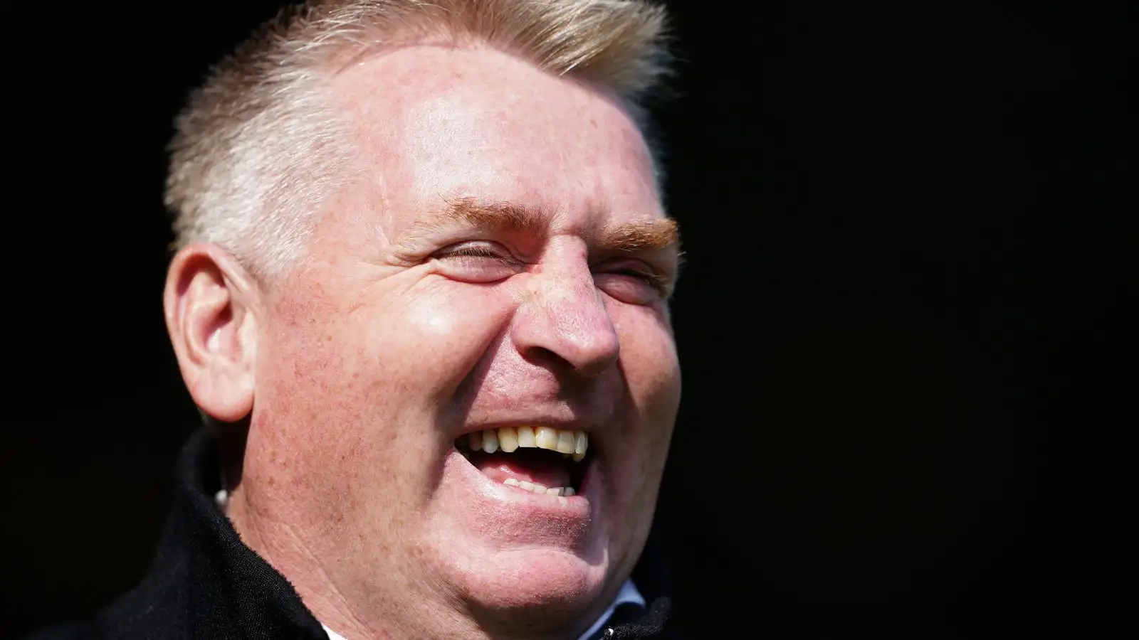 Norwich boss Dean Smith laughs