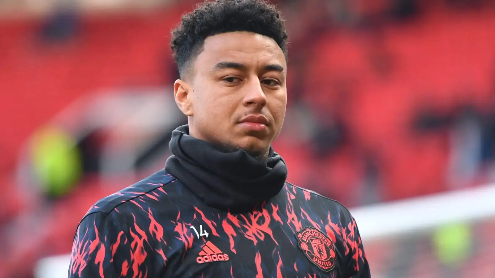 Jesse Lingard warms up before a Manchester United match.