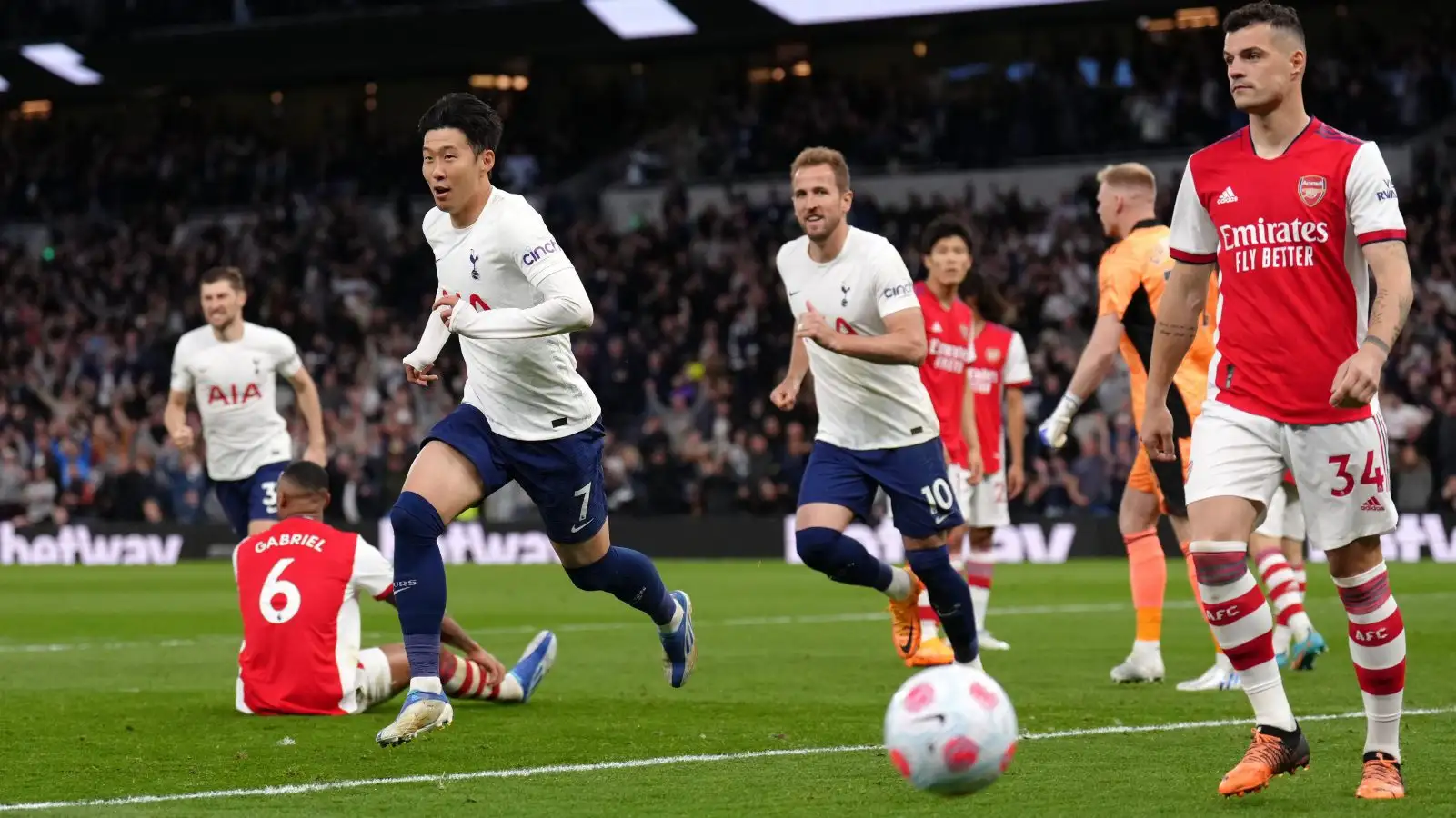 Heung-min Son celebrates scoring for Tottenham against Arsenal.