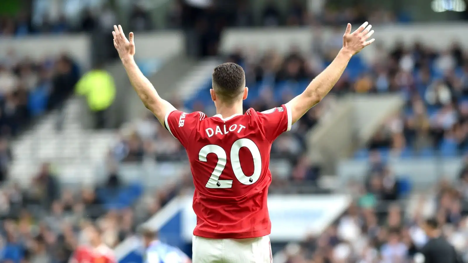Man Utd defender Diogo Dalot throws his hands up in the air