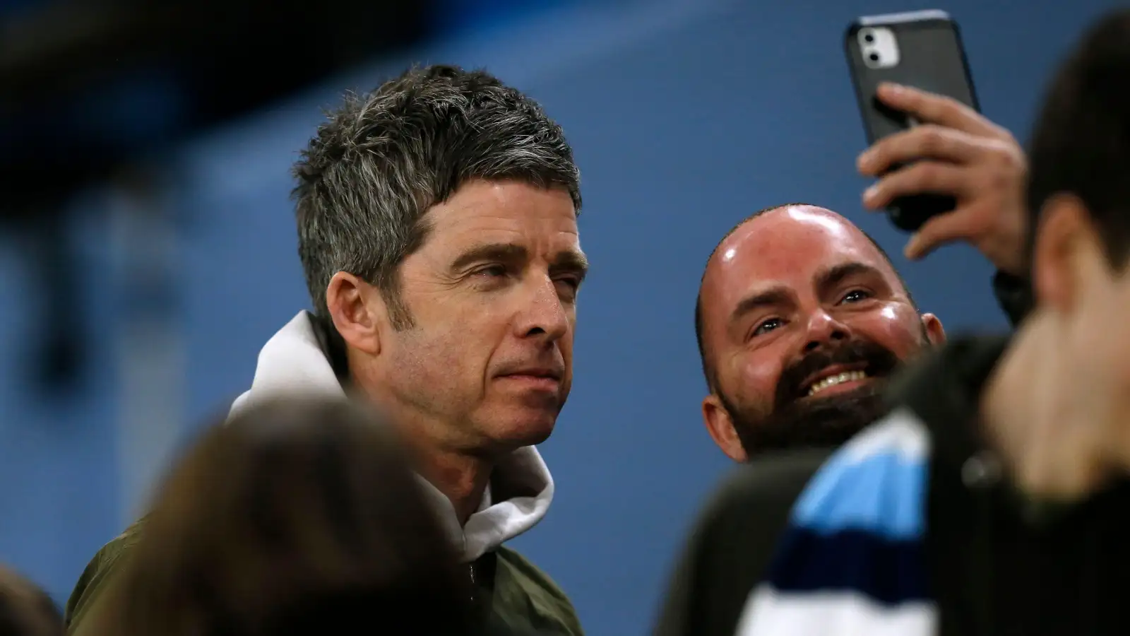 Noel Gallagher takes a selfie with a fan