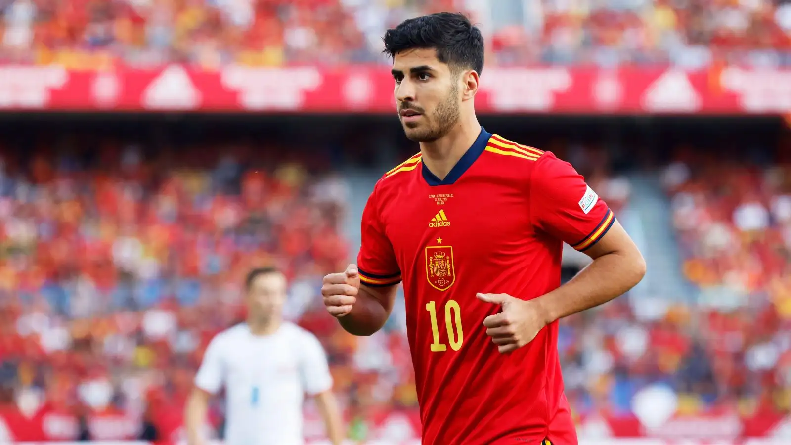 Arsenal target Marco Asensio jogs towards the ball