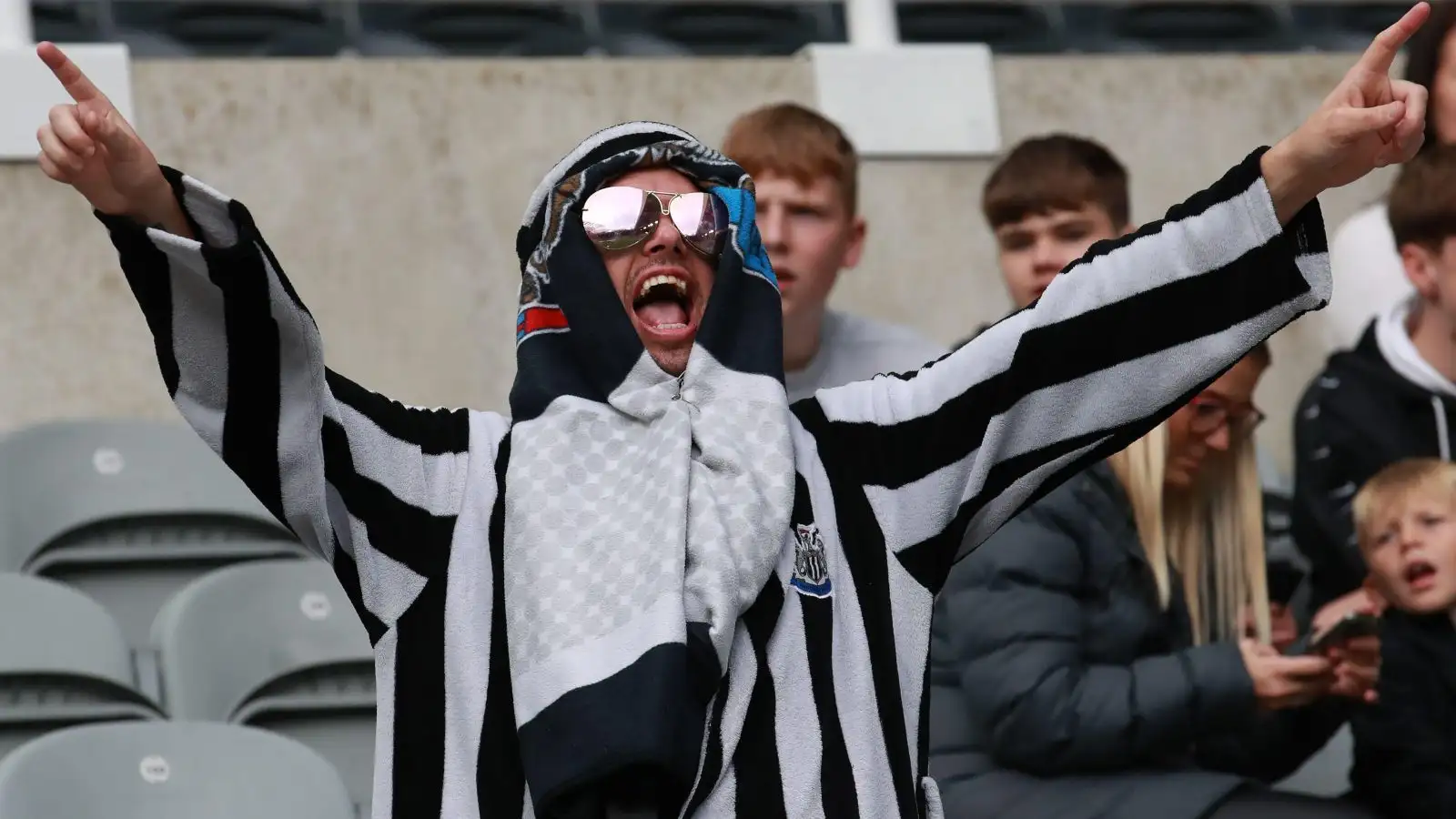A Newcastle fan at the first game after the Saudi takeover.