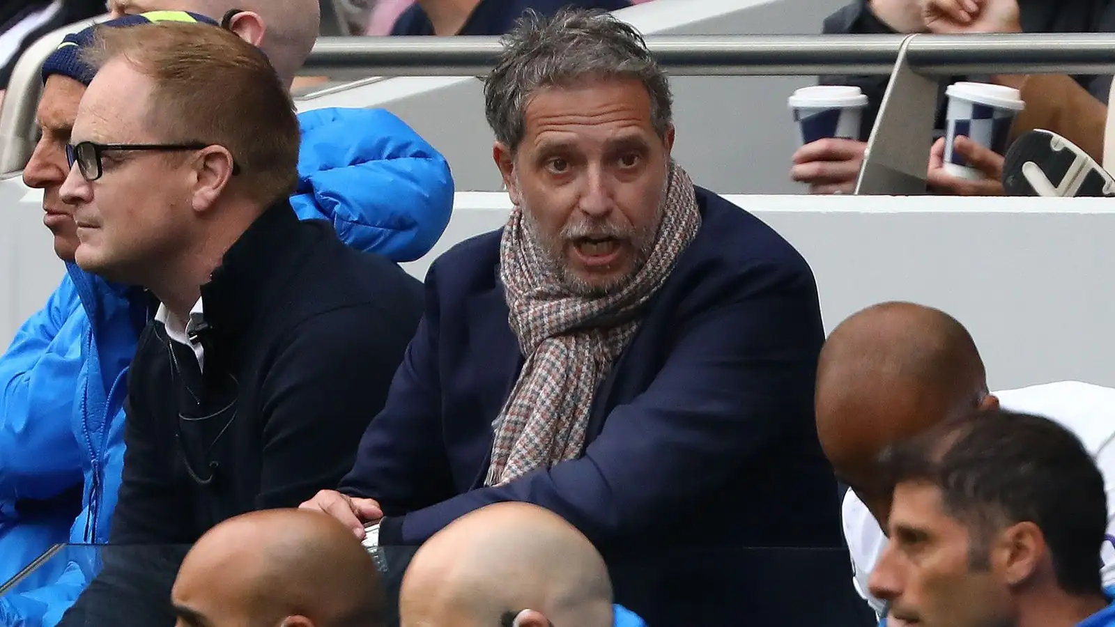Tottenham managing director of football Fabio Paratici speaks to a coach
