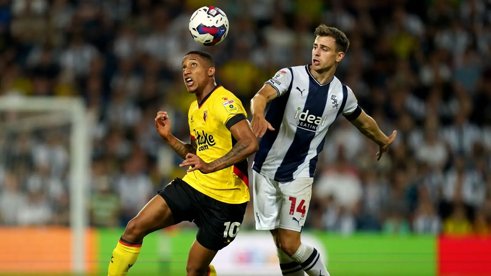 Newcastle target Joao Pedro heads the ball past a player