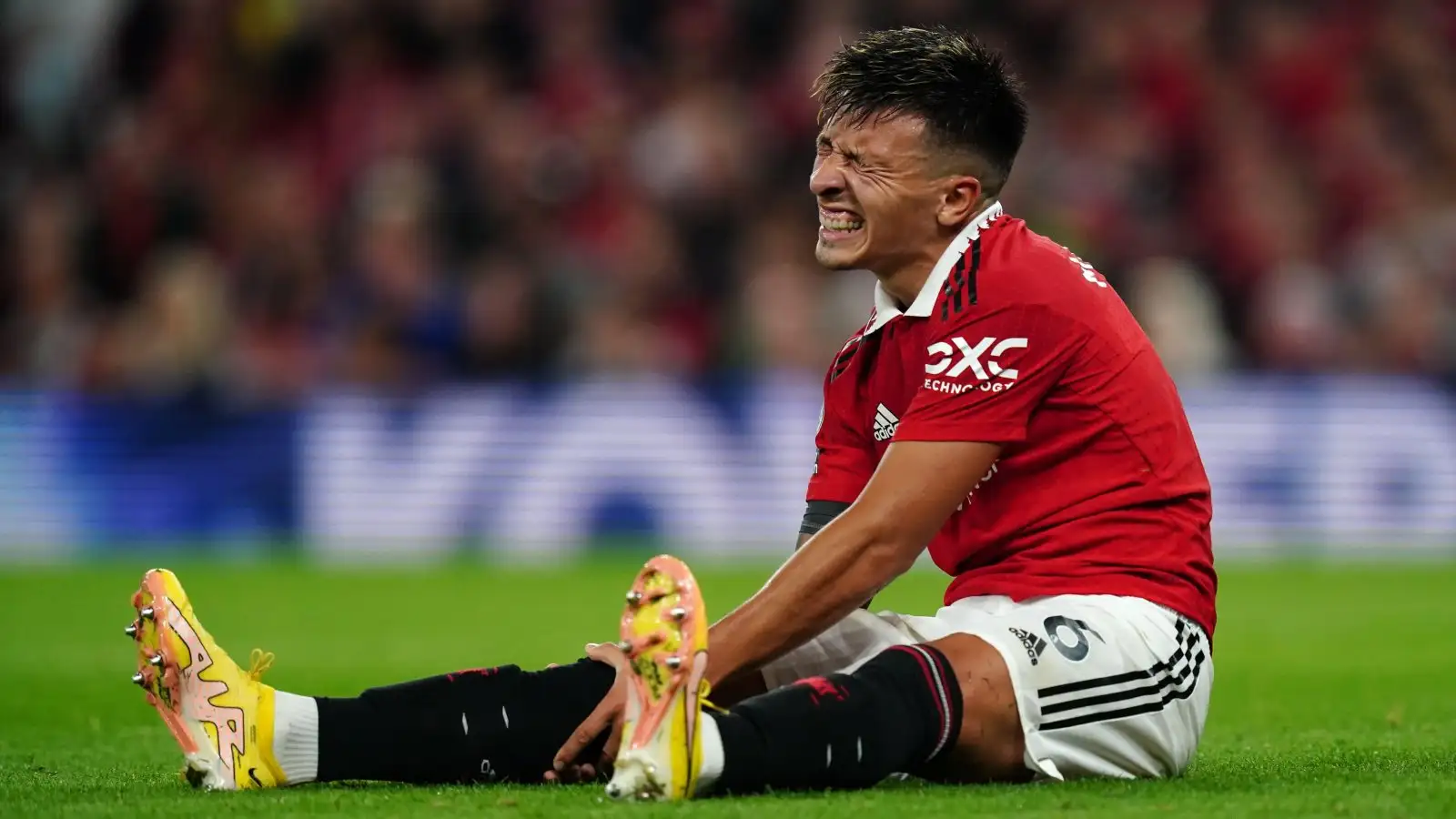 Manchester United defender Lisandro Martinez looks pained