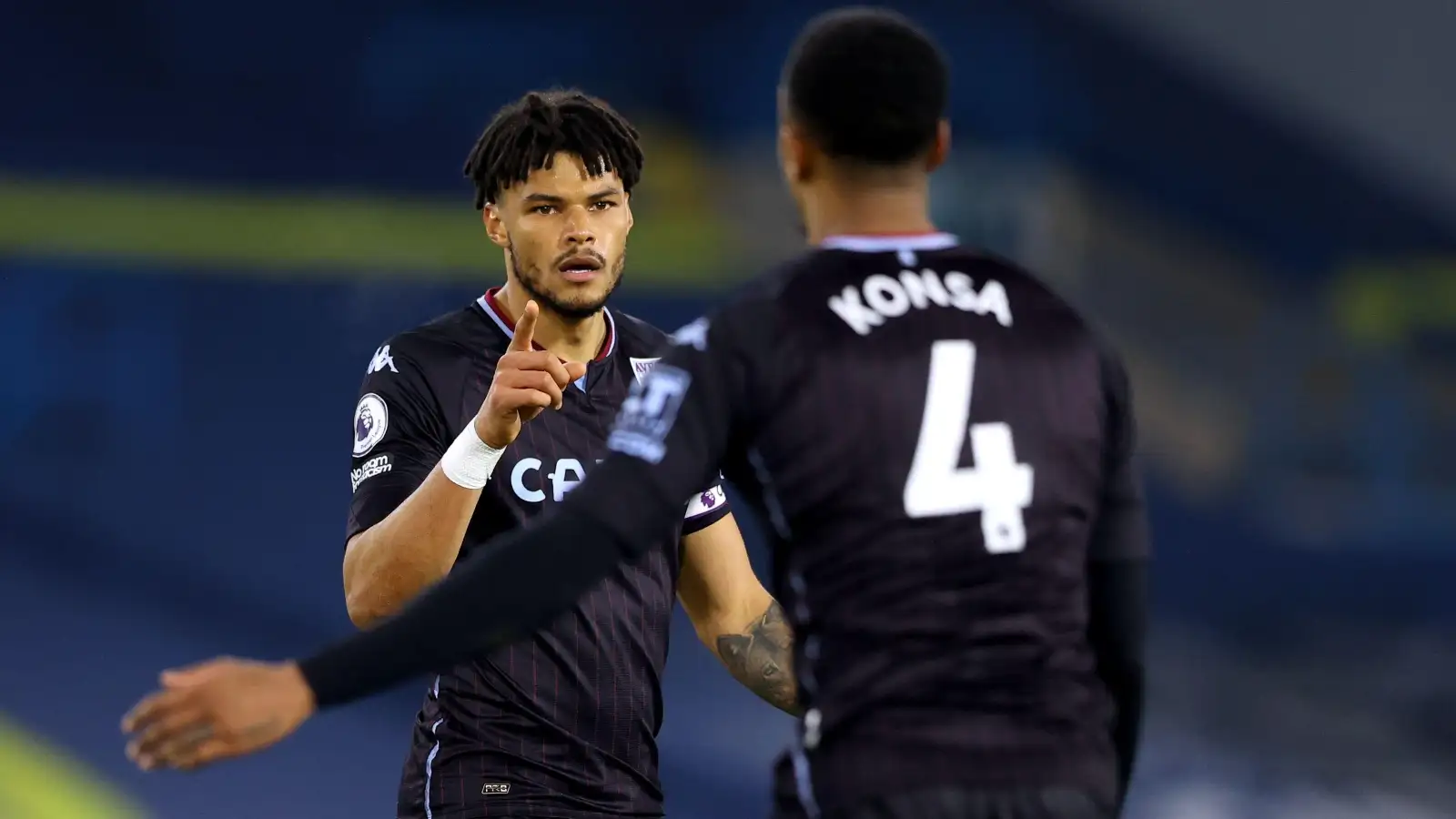Tyrone Mings and Ezri Konsaexchange words at the end of the Premier League match at Elland Road