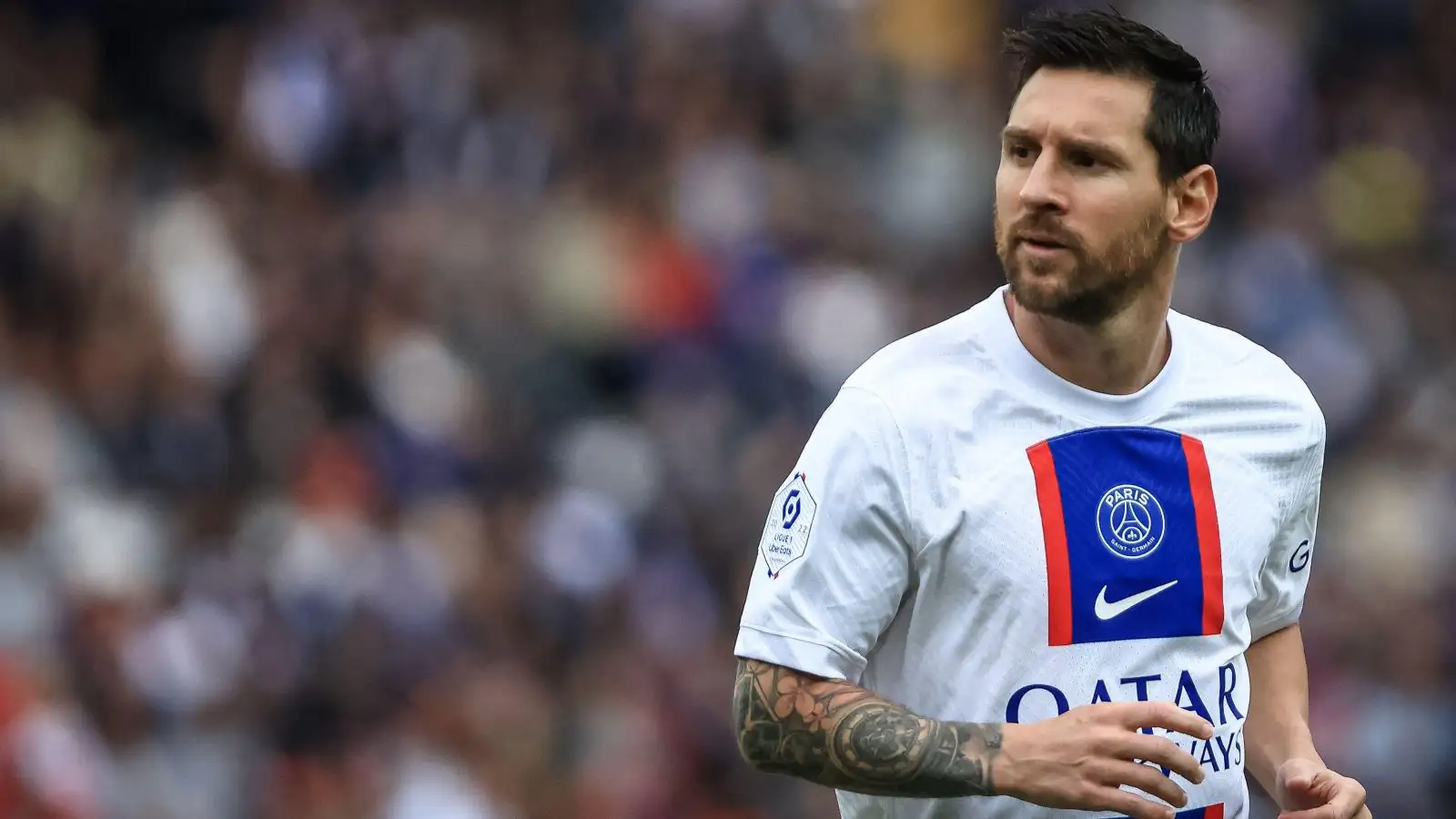 Former Barcelona star Lionel Messi runs around the pitch
