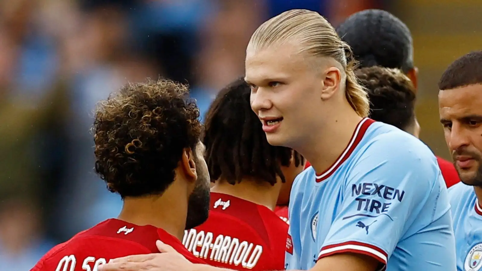 Mo Salah embraces Erling Haaland