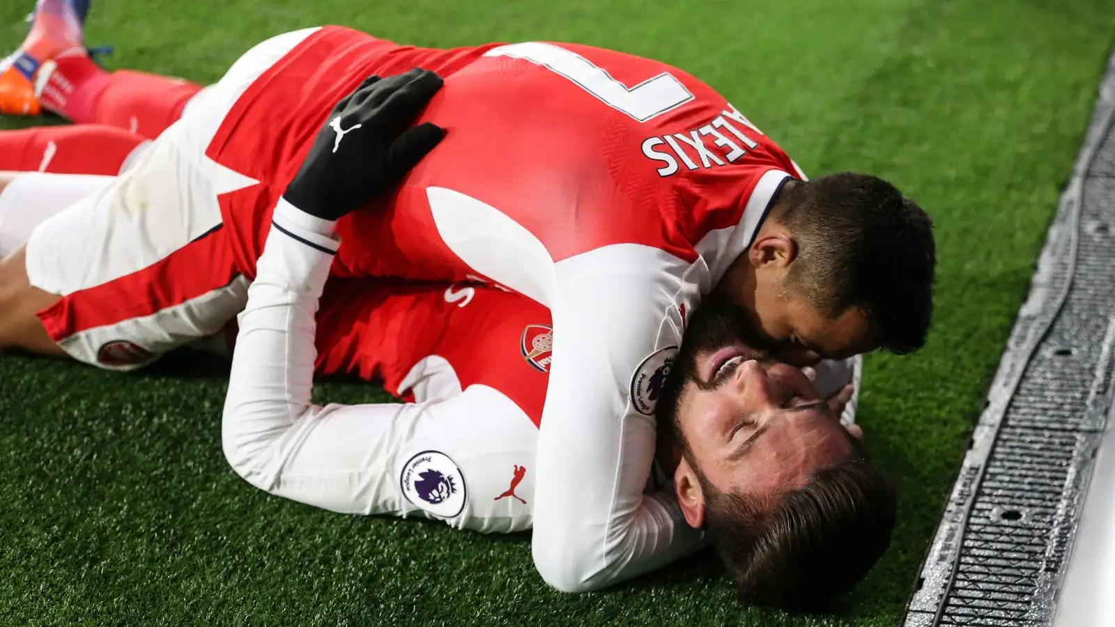 Arsenal forward Alexis Sanchez celebrates with Olivier Giroud