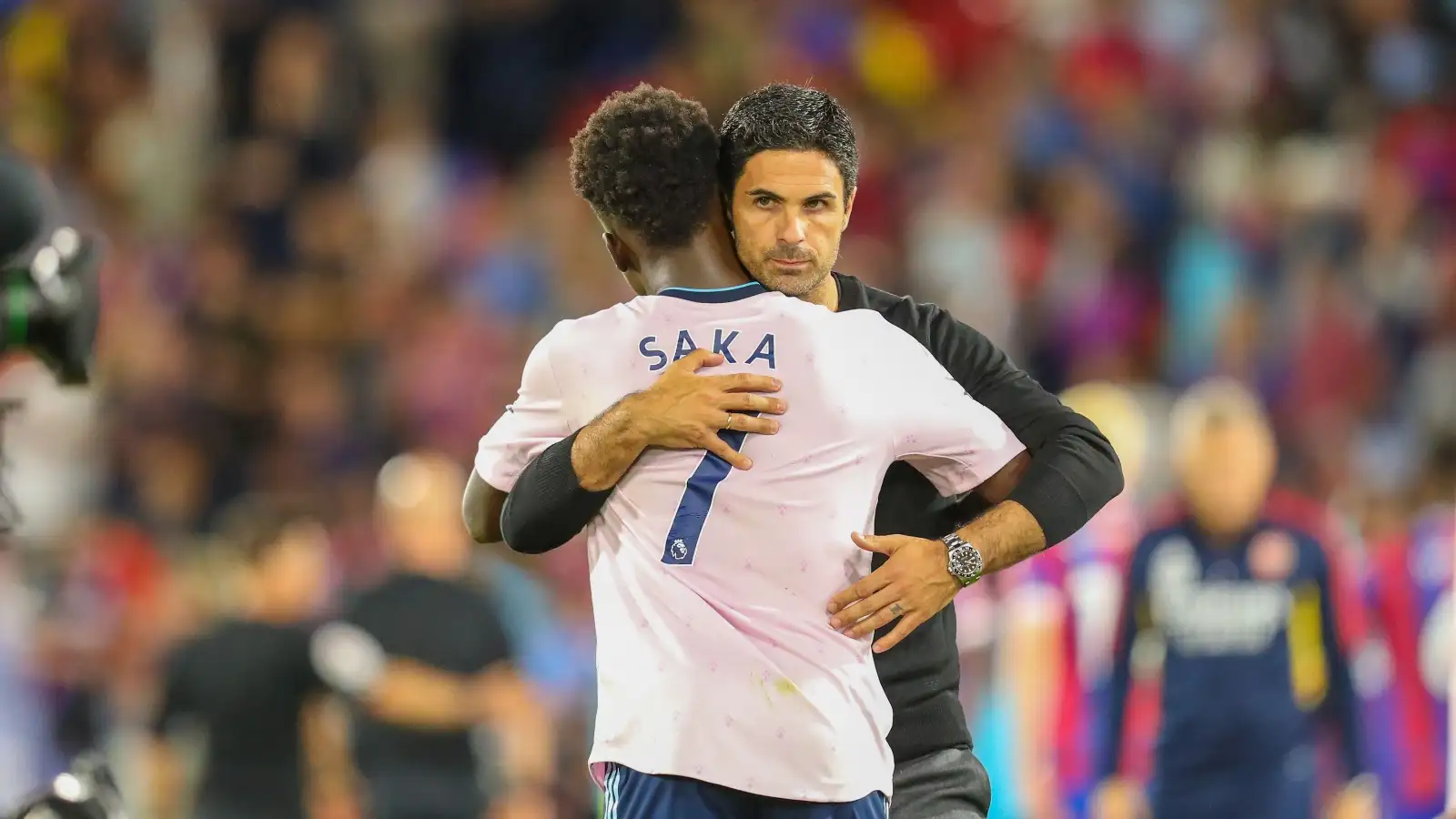 Mikel Arteta hugs Bukayo Saka