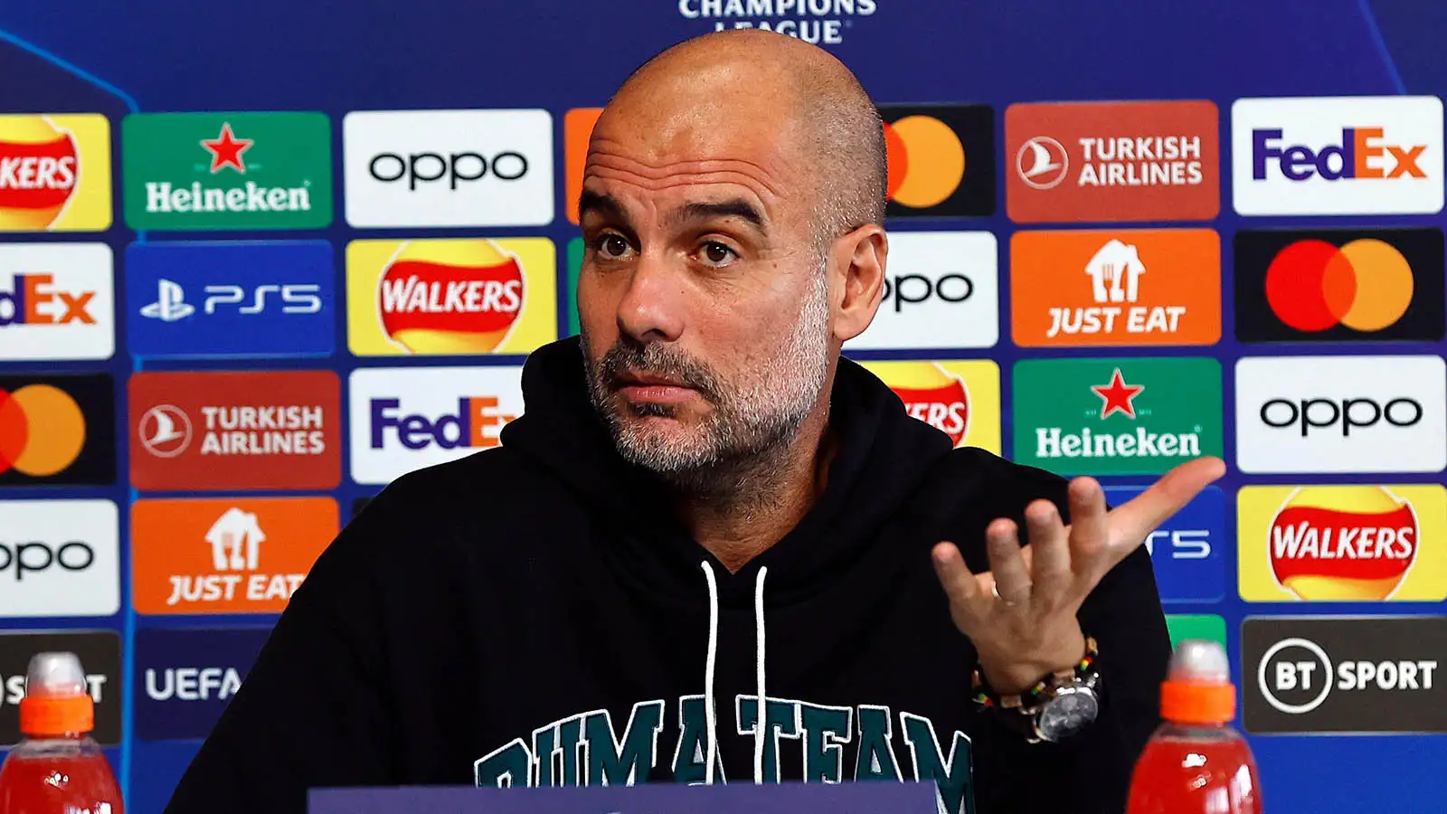 Manchester City manager Pep Guardiola talks to the media