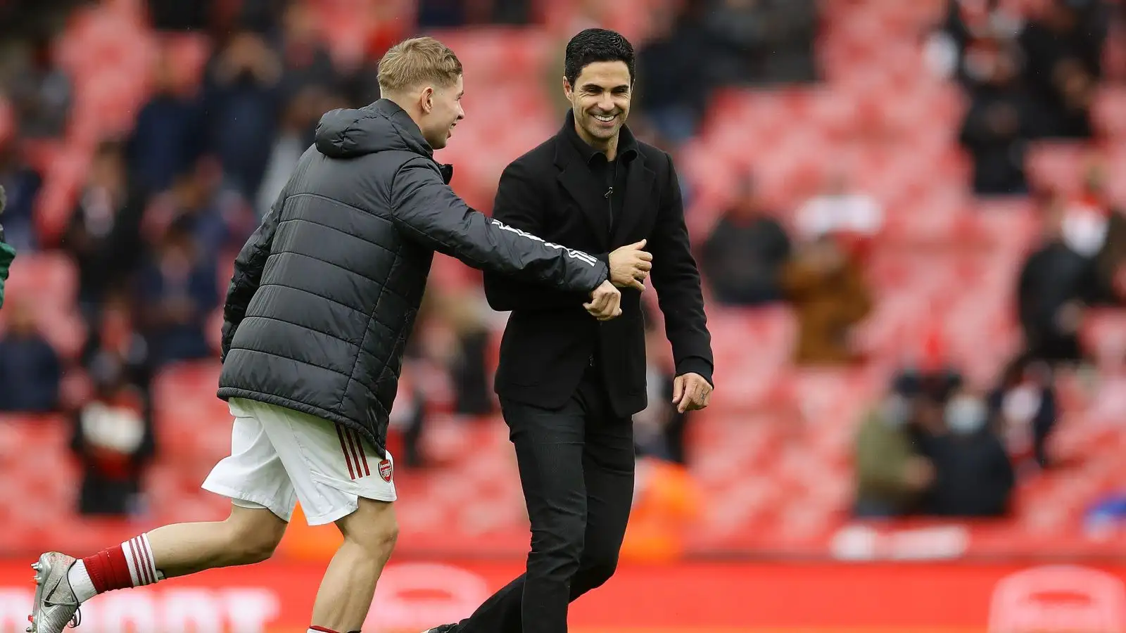 Arsenal midfielder Emile Smith Rowe and Mikel Arteta share a laugh