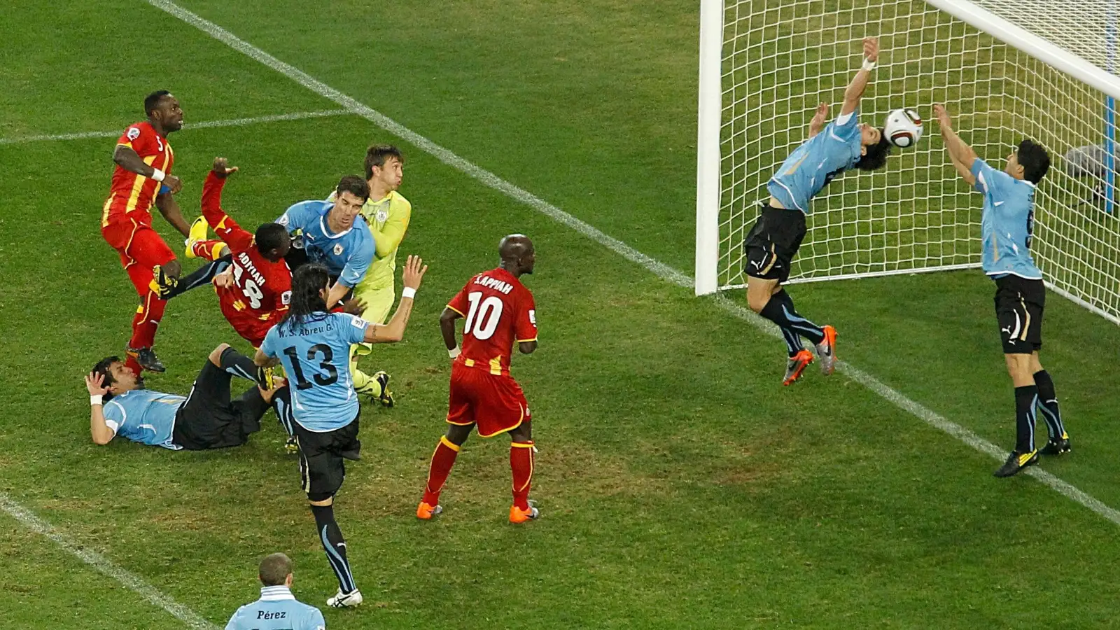 Luis Suarez handles the ball on the line