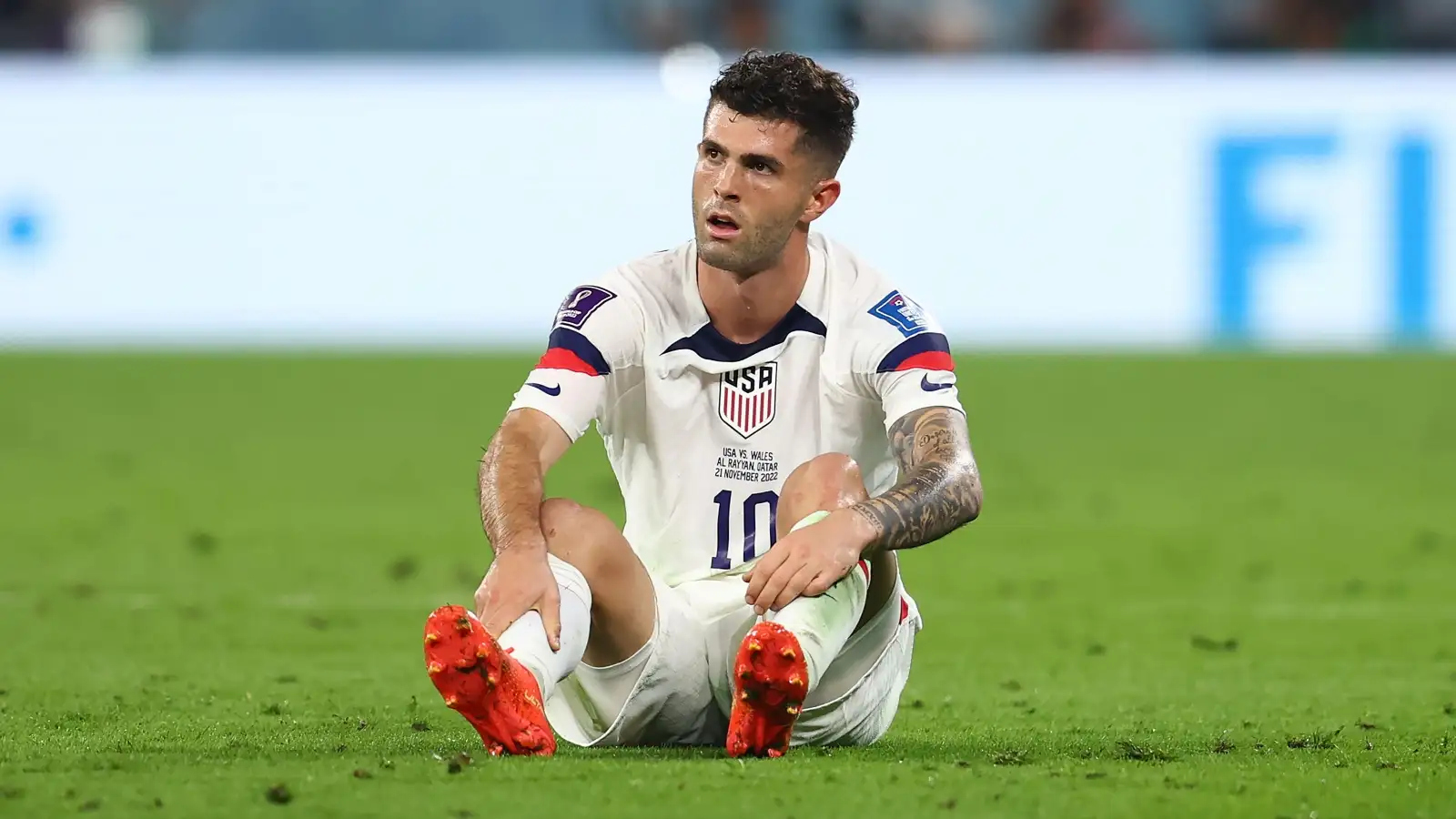 Reported Newcastle target Christian Pulisic sits on the ground during a match for the USA