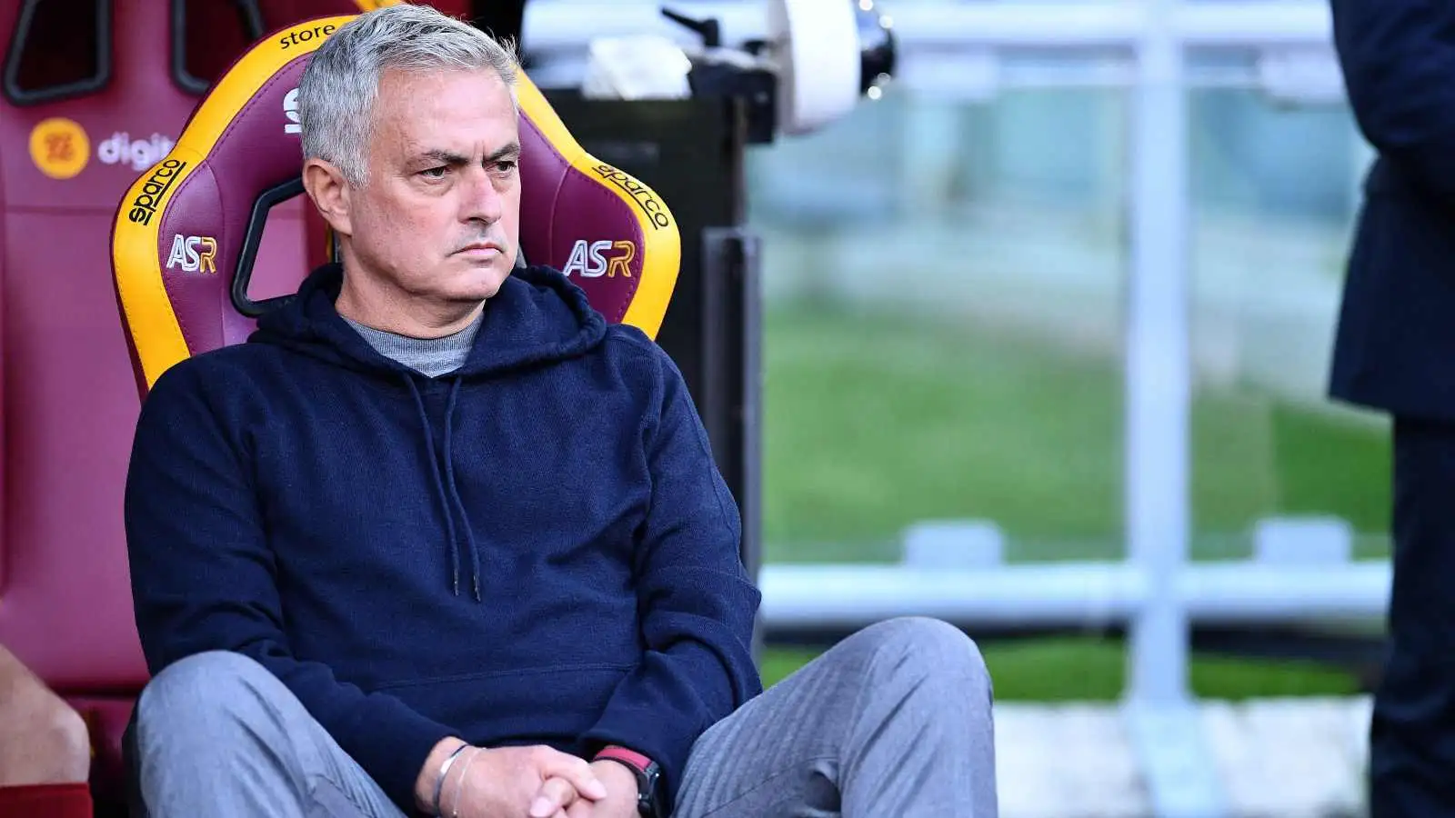 Jose Mourinho sat on the bench before a game