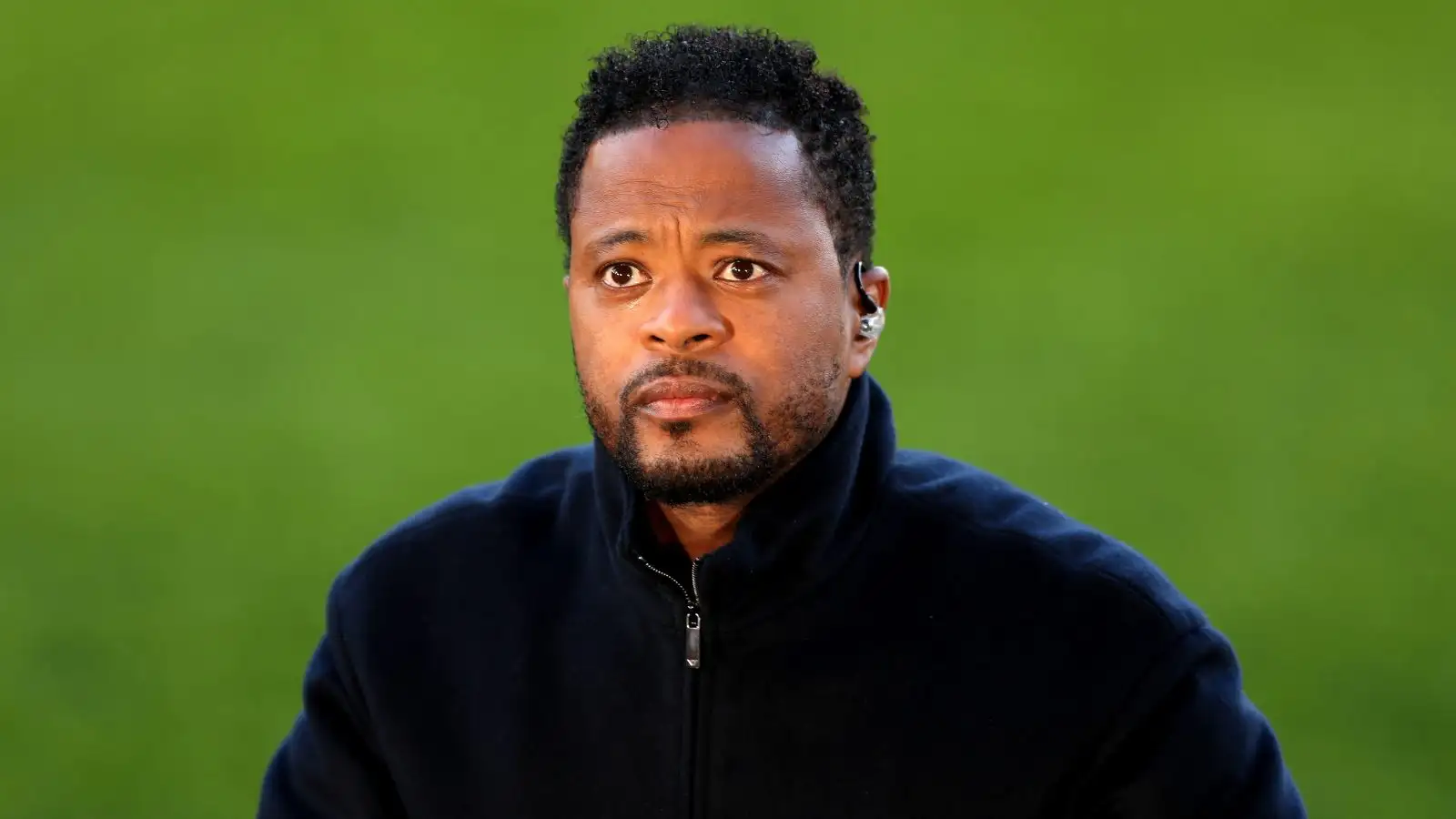 Former Man Utd defender Patrice Evra looks into the cameras