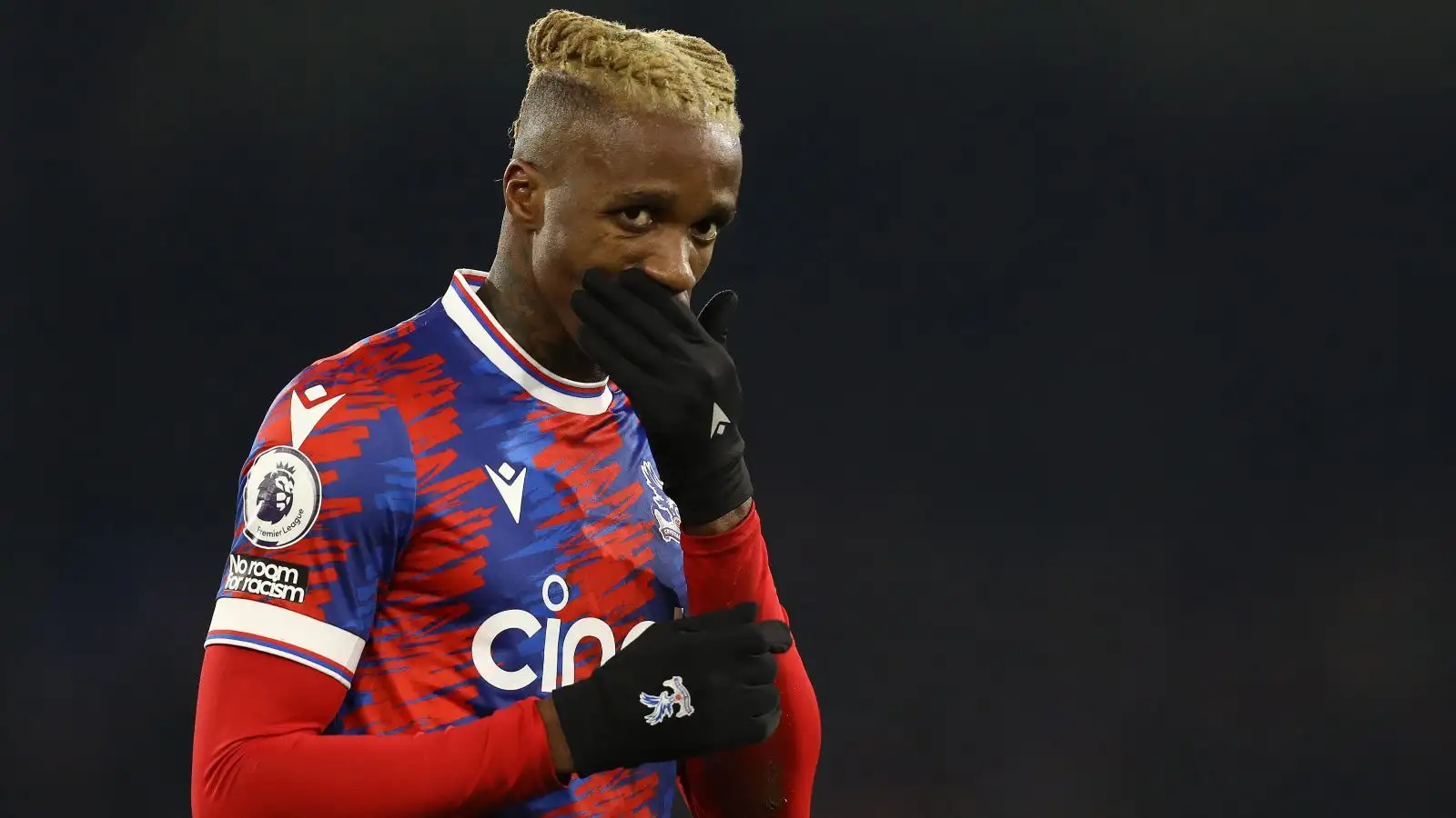 Liverpool target Wilfried Zaha covers his mouth