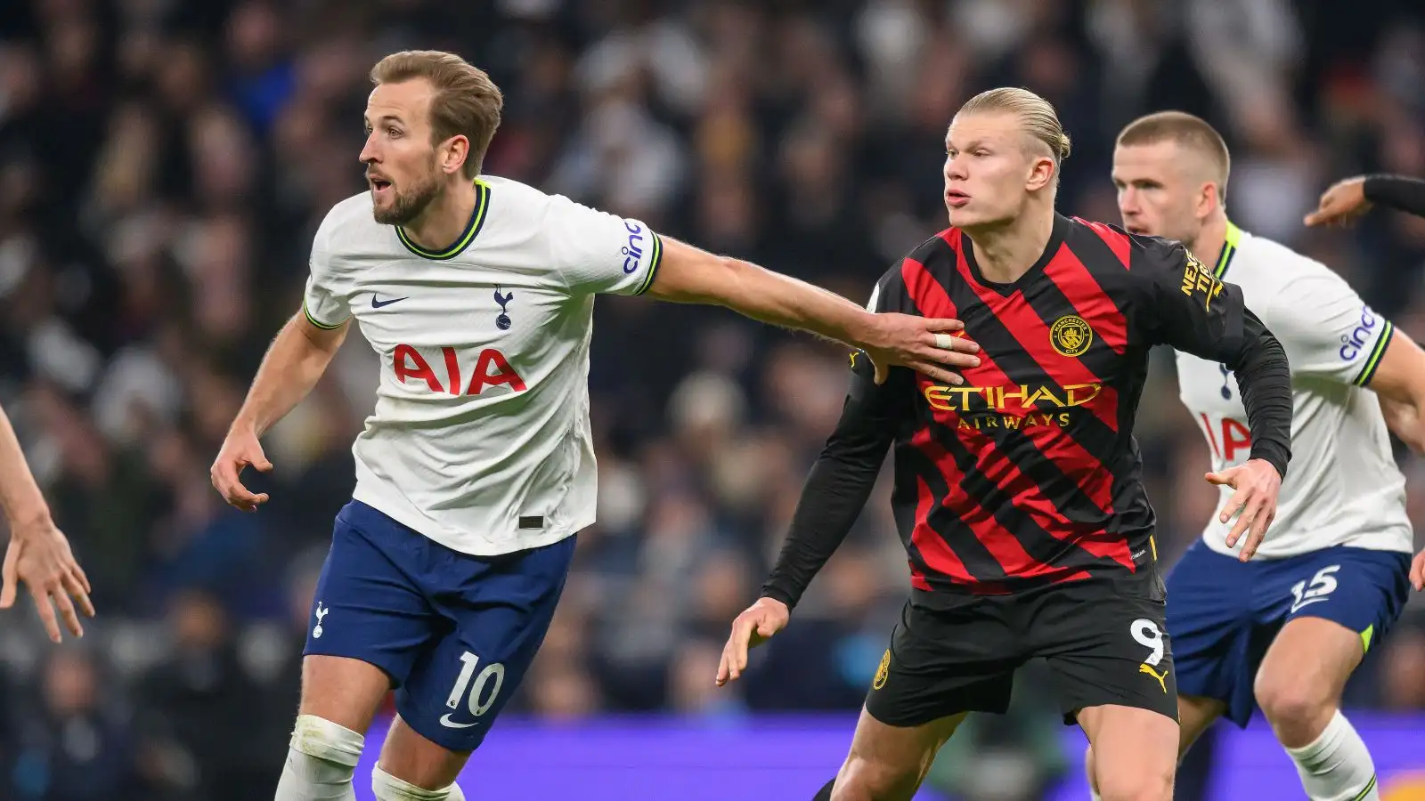 Harry Kane and Erling Haaland tussle during a Premier League game between Tottenham and Manchester City