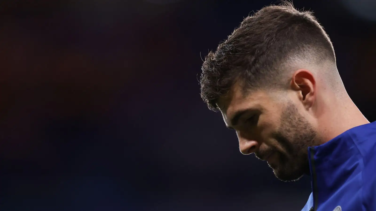 Chelsea winger Christian Pulisic looks at the ground during a pre-match warm-up