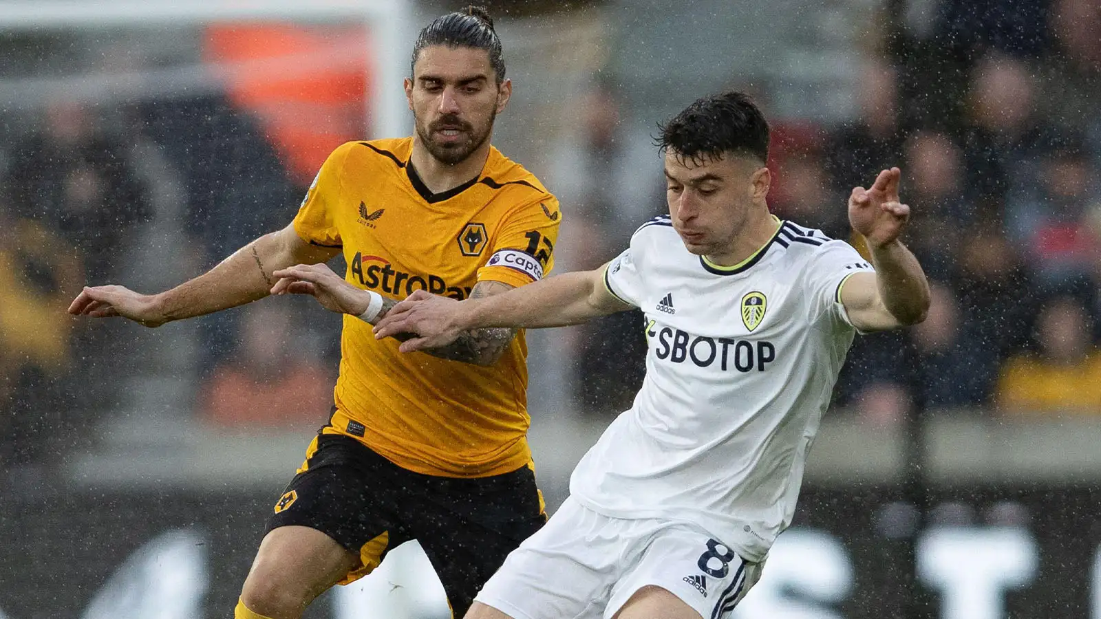 Leeds United's Marc Roca and Rúben Neves of Wolves during the Premier League match between Wolverhampton Wanderers and Leeds United at Molineux, Wolverhampton on Saturday 18th March 2023.